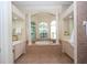 Elegant bathroom with a soaking tub and double vanity at 34303 Sahalee Loop, Dade City, FL 33525
