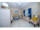 Charming bedroom with wicker furniture and cheerful decor at 34303 Sahalee Loop, Dade City, FL 33525