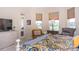 Main bedroom with large bed, sitting area, and golf course view at 34303 Sahalee Loop, Dade City, FL 33525