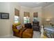 Relaxing bedroom with leather armchairs and large windows at 34303 Sahalee Loop, Dade City, FL 33525