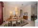 Formal dining room with a chandelier, hardwood floors, and built-ins at 34303 Sahalee Loop, Dade City, FL 33525