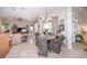 Dining area with glass table and chairs, near kitchen and Gathering room at 34303 Sahalee Loop, Dade City, FL 33525