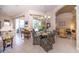 Bright dining room with seating for four and view of pool area at 34303 Sahalee Loop, Dade City, FL 33525