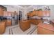 Spacious kitchen with island, stainless steel appliances, and granite countertops at 34303 Sahalee Loop, Dade City, FL 33525