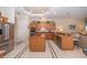 Kitchen with island, stainless steel appliances, and granite countertops at 34303 Sahalee Loop, Dade City, FL 33525