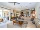 Spacious living room with L-shaped sofa and large windows at 34303 Sahalee Loop, Dade City, FL 33525