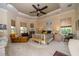 Large main bedroom with a king-size bed and sitting area at 34303 Sahalee Loop, Dade City, FL 33525