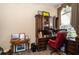 Home office with built-in desk and red leather chair at 34303 Sahalee Loop, Dade City, FL 33525