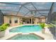 Large screened pool with spa and golf course view at 34303 Sahalee Loop, Dade City, FL 33525