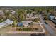 Aerial view showing a house with a pool and surrounding landscape at 377 Jenico Ct, Spring Hill, FL 34609