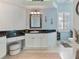 Elegant bathroom with white cabinets, granite countertop and walk-in shower at 377 Jenico Ct, Spring Hill, FL 34609