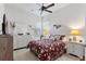 Bright bedroom with a queen bed, double dresser and ceiling fan at 377 Jenico Ct, Spring Hill, FL 34609