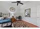 Bright bedroom with wood floors, built-in shelving, and ceiling fan at 377 Jenico Ct, Spring Hill, FL 34609