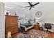 Well-lit bedroom with a twin bed, workspace, and ceiling fan at 377 Jenico Ct, Spring Hill, FL 34609