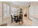 Cozy breakfast nook with a round wooden table and four chairs, near the kitchen at 377 Jenico Ct, Spring Hill, FL 34609