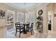 Bright breakfast nook with a round table and chairs, near the kitchen and pool access at 377 Jenico Ct, Spring Hill, FL 34609