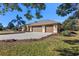 Three-car garage and nicely landscaped front yard at 377 Jenico Ct, Spring Hill, FL 34609