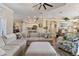 Bright and airy living room with hardwood floors and sectional sofa at 377 Jenico Ct, Spring Hill, FL 34609