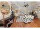 Open concept living area with hardwood floors and ceiling fan at 377 Jenico Ct, Spring Hill, FL 34609