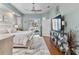 Main bedroom with a plush bed, a large TV, and access to a private balcony at 377 Jenico Ct, Spring Hill, FL 34609
