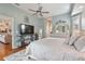 Serene main bedroom with a king-size bed, ample space, and access to the bathroom at 377 Jenico Ct, Spring Hill, FL 34609