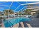 Inviting screened-in pool with a spacious patio area at 377 Jenico Ct, Spring Hill, FL 34609