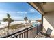 Balcony view of the beach, pool, and ocean at 3820 Gulf Blvd # 203, St Pete Beach, FL 33706