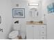 Clean bathroom with white vanity and toilet at 3820 Gulf Blvd # 203, St Pete Beach, FL 33706