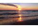 Stunning sunset view over the ocean waves at 3820 Gulf Blvd # 203, St Pete Beach, FL 33706
