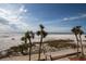 View from condo of beach, ocean, palm trees at 3820 Gulf Blvd # 203, St Pete Beach, FL 33706