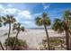 Stunning beach view from balcony, palm trees at 3820 Gulf Blvd # 203, St Pete Beach, FL 33706