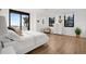 Main bedroom with ocean view and light wood floors at 3820 Gulf Blvd # 203, St Pete Beach, FL 33706