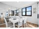 Ocean view dining room with white table and chairs at 3820 Gulf Blvd # 203, St Pete Beach, FL 33706