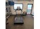 Fitness room with a treadmill and ocean view at 3820 Gulf Blvd # 203, St Pete Beach, FL 33706