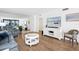 Relaxing living room featuring hardwood floors and ocean views at 3820 Gulf Blvd # 203, St Pete Beach, FL 33706