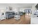 Living room with hardwood floors and ocean view at 3820 Gulf Blvd # 203, St Pete Beach, FL 33706