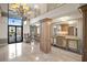 Building Lobby with seating area and large chandelier at 3820 Gulf Blvd # 203, St Pete Beach, FL 33706