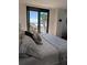 Main bedroom with ocean view and comfortable bedding at 3820 Gulf Blvd # 203, St Pete Beach, FL 33706