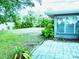 Backyard with grassy area, patio, and tropical plants at 3843 19Th N Ave, St Petersburg, FL 33713