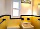 Retro bathroom with yellow and black tile and updated sink at 3843 19Th N Ave, St Petersburg, FL 33713