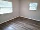 Simple bedroom with dark gray vinyl flooring and neutral walls at 3843 19Th N Ave, St Petersburg, FL 33713