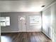 Bright living room with dark gray vinyl flooring and neutral walls at 3843 19Th N Ave, St Petersburg, FL 33713