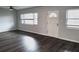 Spacious living room with dark gray vinyl flooring and neutral walls at 3843 19Th N Ave, St Petersburg, FL 33713