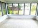 Sunroom features multiple windows and a view of the backyard at 3843 19Th N Ave, St Petersburg, FL 33713
