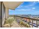Balcony with table and chairs overlooking city and water views, a perfect spot for outdoor relaxation at 400 Island Way # 1404, Clearwater Beach, FL 33767