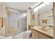 Bright bathroom featuring a large, glass-enclosed shower and a modern vanity with a beige countertop at 400 Island Way # 1404, Clearwater Beach, FL 33767