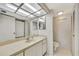 Bathroom featuring a vanity with a large mirror, tile floor, and a toilet at 400 Island Way # 1404, Clearwater Beach, FL 33767