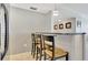 Cozy breakfast bar with granite countertop and seating, perfect for casual dining at 400 Island Way # 1404, Clearwater Beach, FL 33767