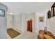 Hallway with tile flooring and ample closet space, featuring a decorative wooden cabinet at 400 Island Way # 1404, Clearwater Beach, FL 33767