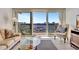 Living room with water views and balcony access at 400 Island Way # 1404, Clearwater Beach, FL 33767